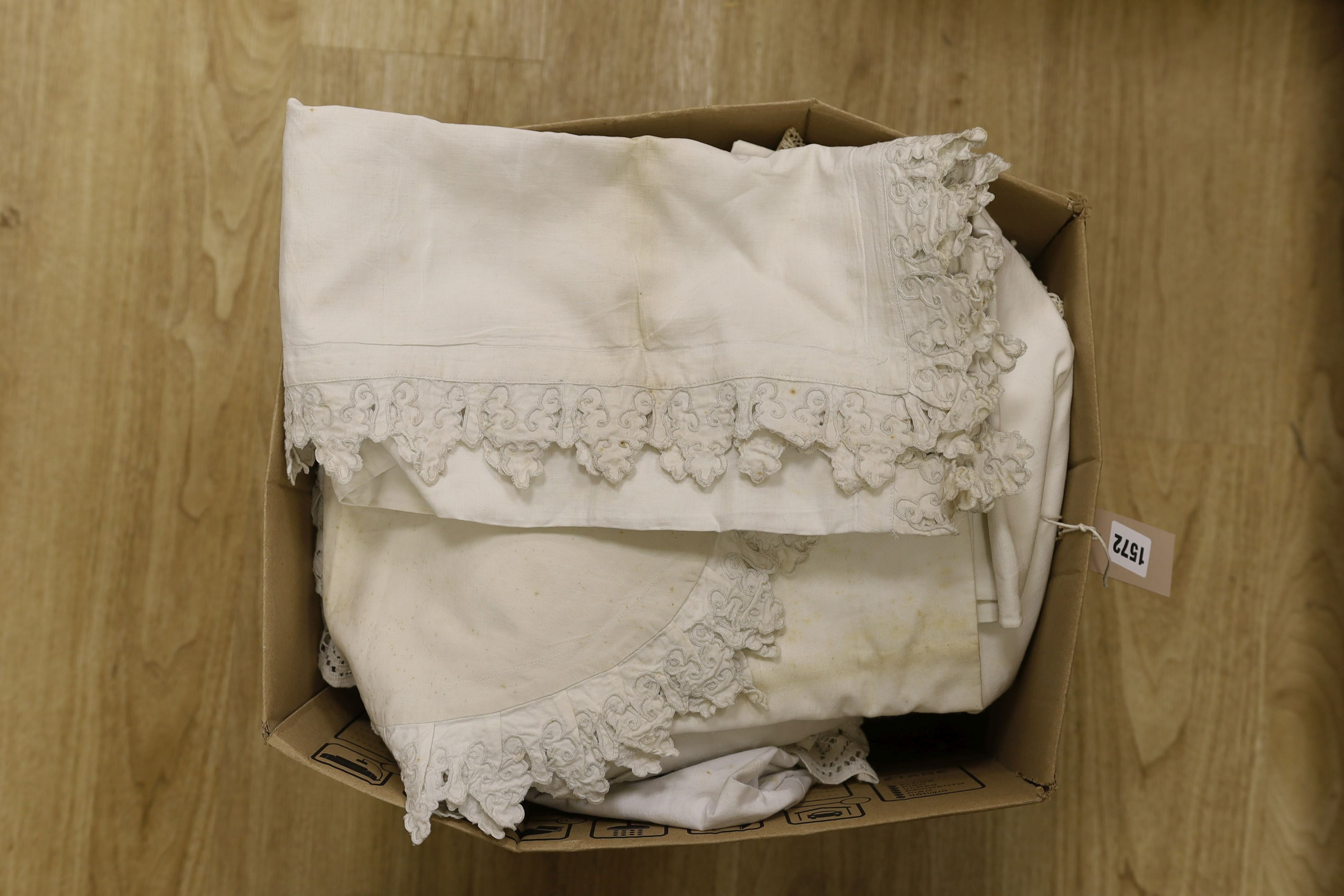 A large quantity of embroidered pillow cases